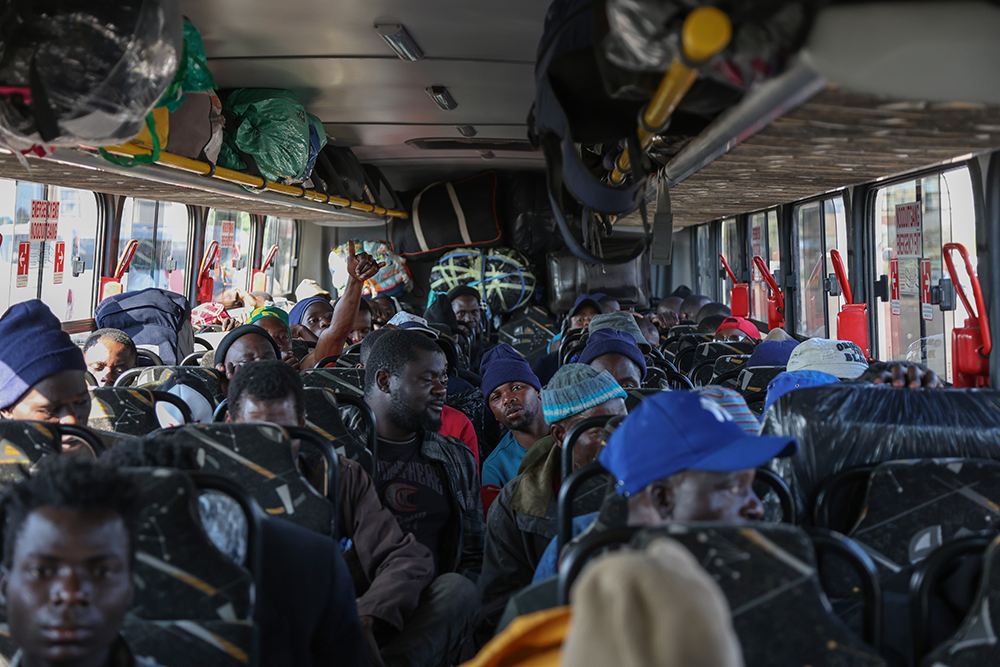Malawian nationals sit aboard a bus at the Durban Drive-In temporary repatriation centre in Durban, South Africa, on 1 July 2026, ahead of their departure for Malawi as part of a voluntary repatriation programme. Photo: Felix Dlangamandla/Daily Maverick