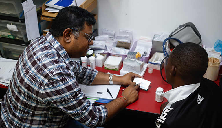 Dr. Rishigen Viranna who runs the Usizo Lwethu Sibaya Clinic at the Denis Hurley Centre sees a patient in Durban, 19 October 2026. Photo: Rogan Ward/HNF