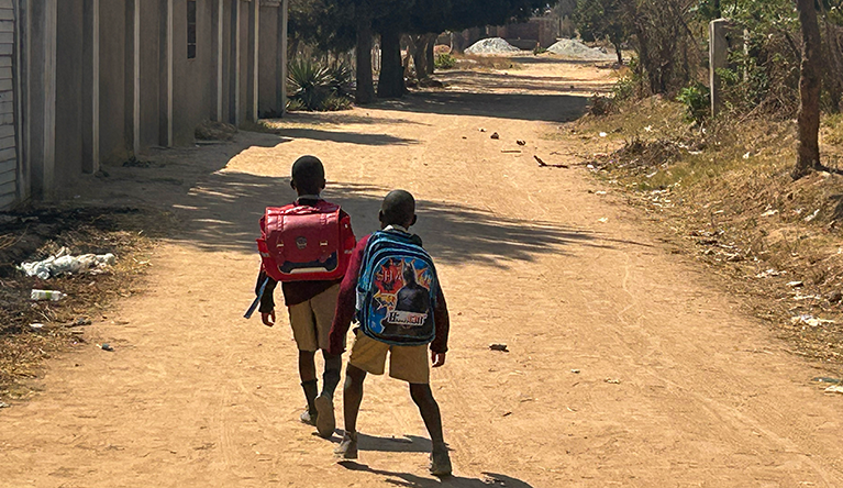 Primary school kids playing on their way home from school. Photo: Calvin Manika